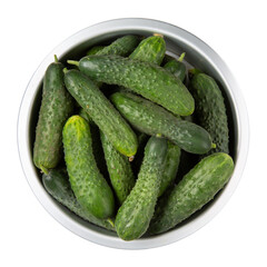 Freshly picked cucumbers in metal bowl isolated. Top view.