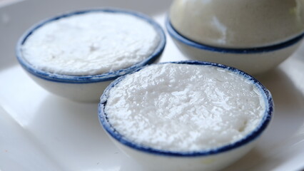 coconut milk custard in small porcelain cup (Thai dessert).