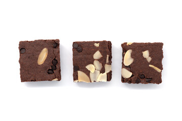 Brownies  isolated white background. Chocolate brownie with sliced almond nuts toppings. Chocolate Brownie pieces. selective focus. Top View.