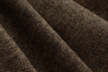 Texture background of rough hard fabric. Fabric in the form of folds close-up. Textile for sewing and design.