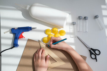 Step-by-step instructions for making crafts from improvised materials. Handmade at school craft rocket for the day of cosmonautics. Step 8