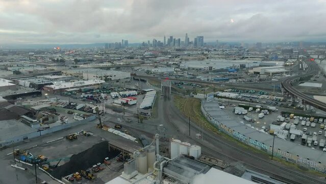 March 2023 - 4K aerial of full LA River on a stormy day in Downtown Los Angeles, California, USA.