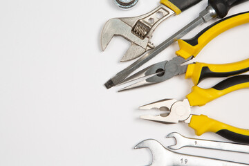 Set of tools for repair in a case on a white background. Assorted work or construction tools. Wrenches, Pliers, screwdriver. Top view