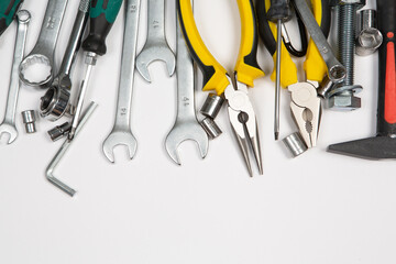 Set of tools for repair in a case on a white background. Assorted work or construction tools. Wrenches, Pliers, screwdriver. Top view