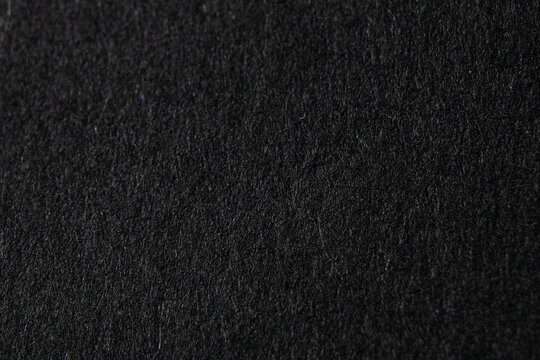 Black fluffy velvet texture background. Black velvet fabric