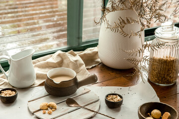 cookies and morning drink (coffee, milk or tea) in light natural envoronment, kinfolk style...