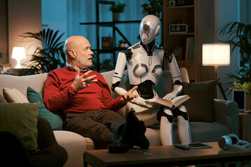 Senior man and android robot reading a book together