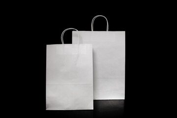 Set of paper bags for shopping on black background. Mockup for design