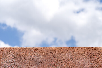 polyurethane foam wall texture with blur blue open sky background.