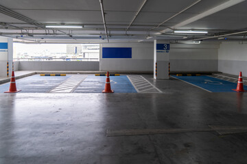 The handicap lot of car parking indoor at department store.