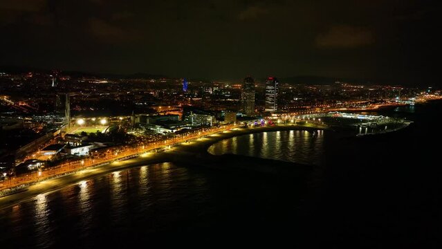 Aerial drone panorama of Villa Olimpica del Poblenou, in the city of Barcelona. Twin skyscrapers of Hotel Arts and Torre Mapfre next to Port Olimpic.