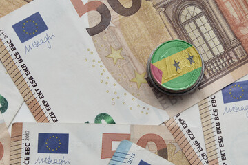 euro coin with national flag of sao tome and principe on the euro money banknotes background