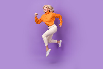 Full body profile portrait of energetic lady jump rush empty space isolated on purple color background