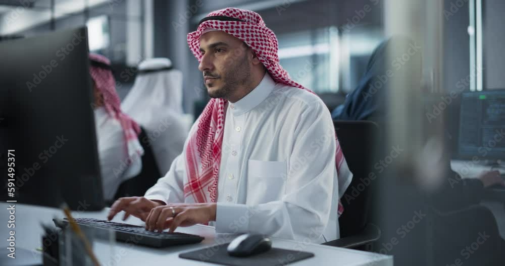 Aufkleber Arab System Administrator Working in a Research E-Business Facility on a Desktop Computer. Focused Middle Eastern Software Developer Updating Server System Database. Gulf Man At Work in Office