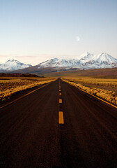 altiplano road at sunset in los flamencos national reserve in antofagasta region