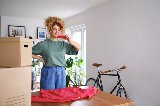 Happy woman photographing through smart phone