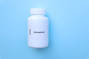 Corticosteroid pill in white bottle, pill stock