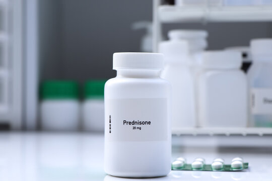 Prednisone pill in white bottle, pill stock