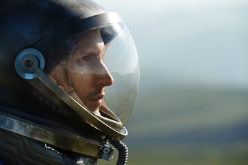 Thoughtful astronaut wearing space helmet