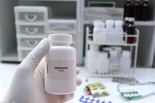 Naltrexone pill in white bottle, pill stock