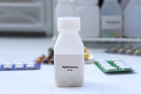 Naltrexone pill in white bottle, pill stock