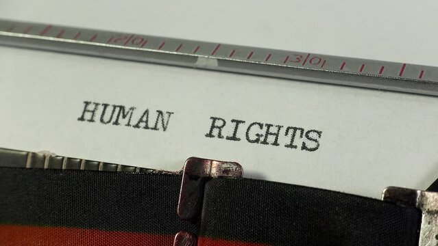 Typing Human Rights on an old manual typewriter. Inherent rights to all human beings. The right to life.