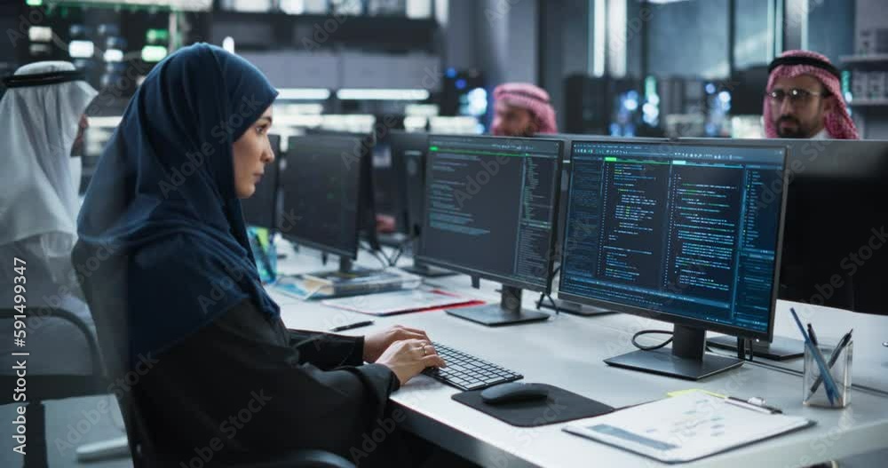 Leinwandbilder middle eastern female working in a company of arab men in a professional technology enterprise. youn