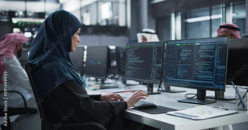 Poster middle eastern female working in a company of arab men in a professional technology enterprise. youn