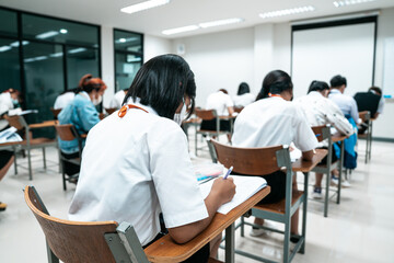 College students doing examinations in the classroom