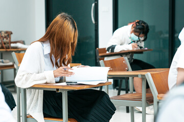 College students doing examinations in the classroom