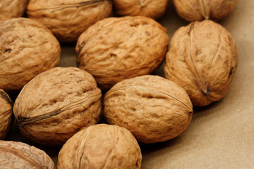 Walnut close up on a wooden table. Walnut close up. product rich in minerals and vitamins. Walnut turns in a shot. 