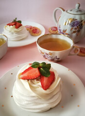 Delicious Pavlova cake dessert with fresh strawberry. White and red dessert