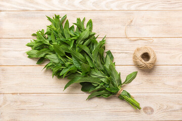 Fresh mint bunch on colored table. Top view with copy space