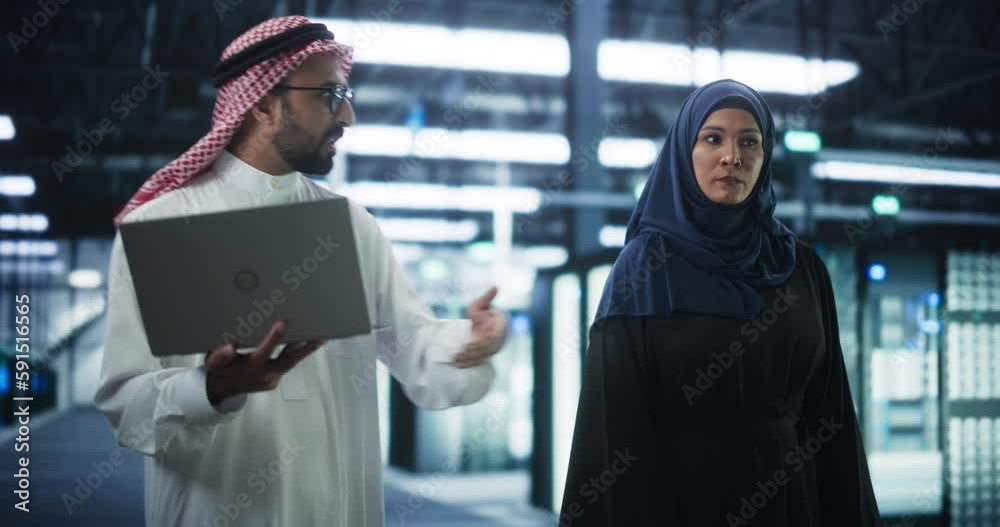 Poster middle eastern computer engineer and cybersecurity specialist work in server facility. muslim female