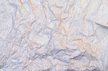 Background of silver and golden wrinkled crepe tissue paper