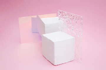Empty podium for product display. Cube white scene pedestal with glass on pink background. Minimal style