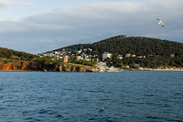 Fototapeta na wymiar blue sea near coastline and houses on Princess islands in Turkey.