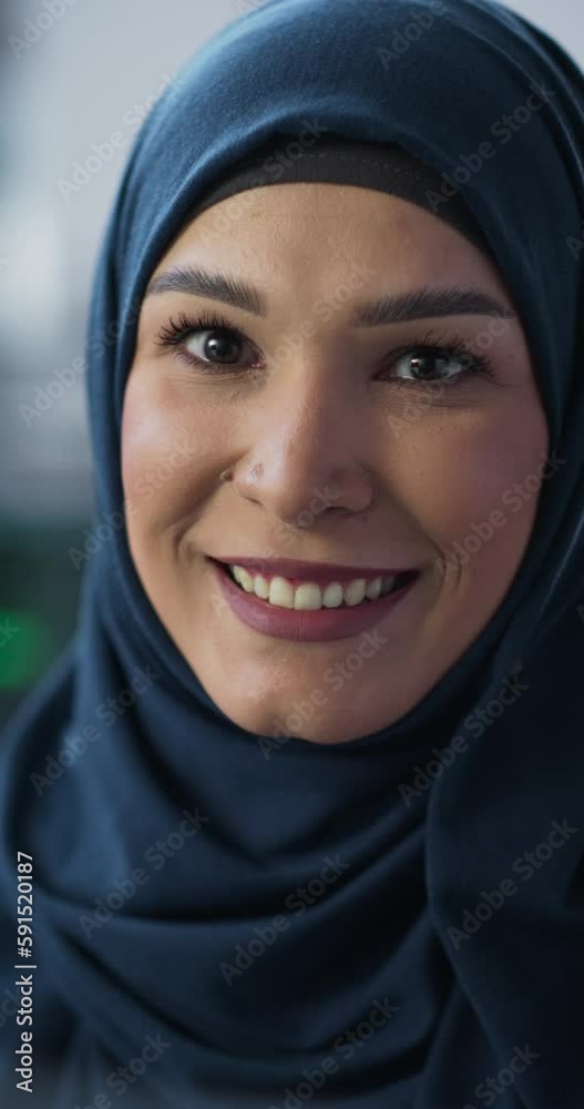 Leinwandbilder Vertical Screen: Portrait of a Middle Eastern Female Using Computer, Looking at Camera and Smiling. Empowered Muslim Information Technology Specialist, Software Engineer, Developer or Data Scientist