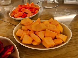 Plate with pieces of melon and tropical fruits