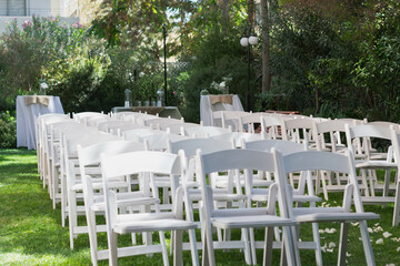 Fototapeta na wymiar Chairs in garden for wedding