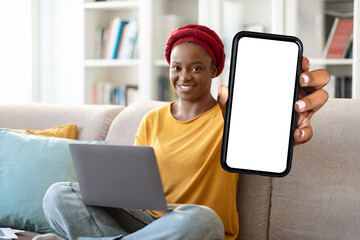 black woman freelancer showing smartphone with white screen