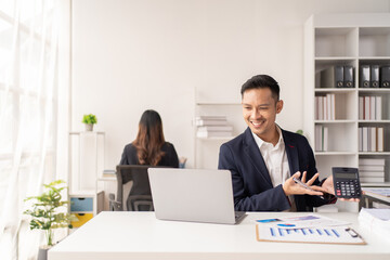 Business man working at the office and smiling .