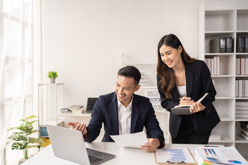The couple of business talking about the project  and make deal in the office.