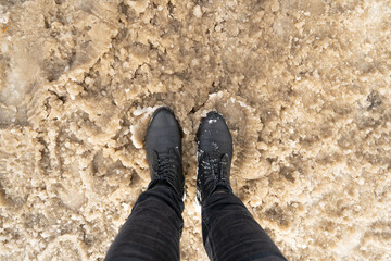 Winter Boots in Wet Dirty Snow, Warm Winter Shoes, Waterproof Surface, Hiking Footwear, Black Winter Boots