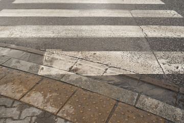 Fototapeta premium Winter Pedestrian Crossing, Dirty, Wet Black White Crosswalk, Safety Zebra