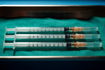 Close-up of a syringes on a metal tray