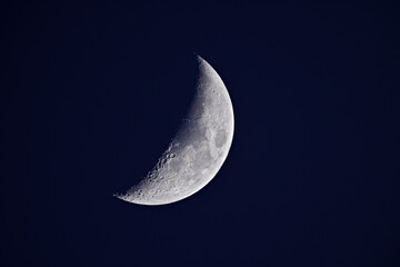 moon in the sky half crescent