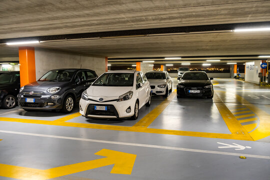 Verona, Italy - October 21, 2019: Modern cars parked inside closed underground parking lot.