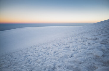 Fototapeta na wymiar Glacier slope of Mount Ararat on the ascent early in the morning, minimalistic alpine landscape