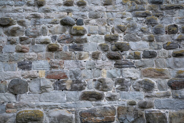 Medieval stone wall, castle wall of natural stone